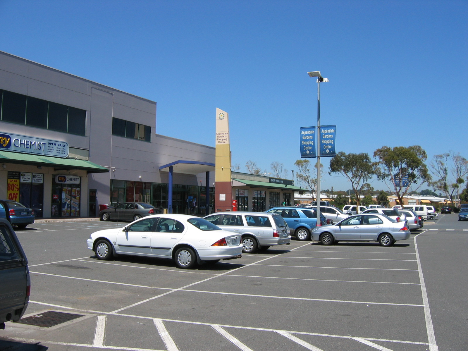 Small Melbourne suburban shopping strip with parking